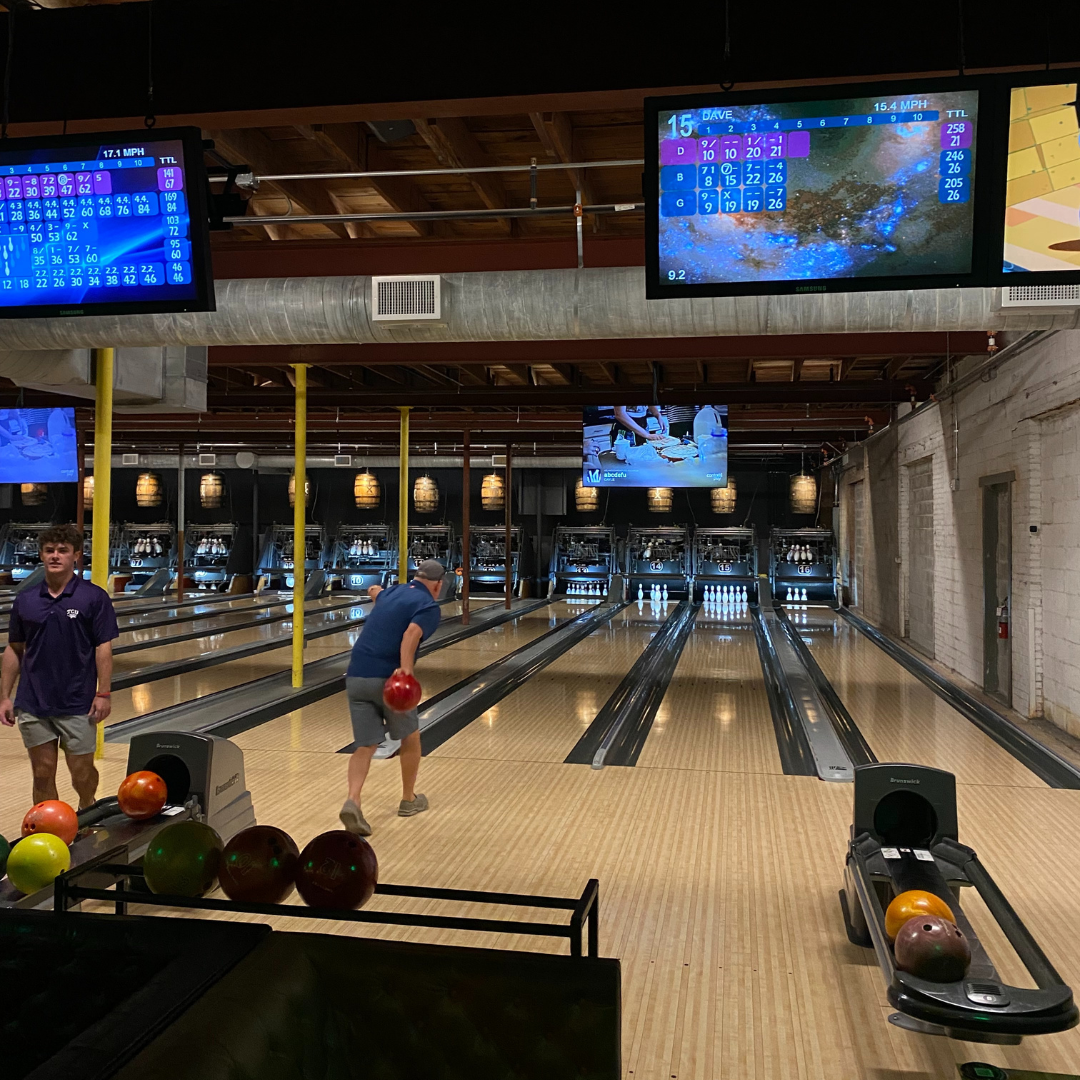 Image of the bowling lanes at bowlounge fort worth with people bowling