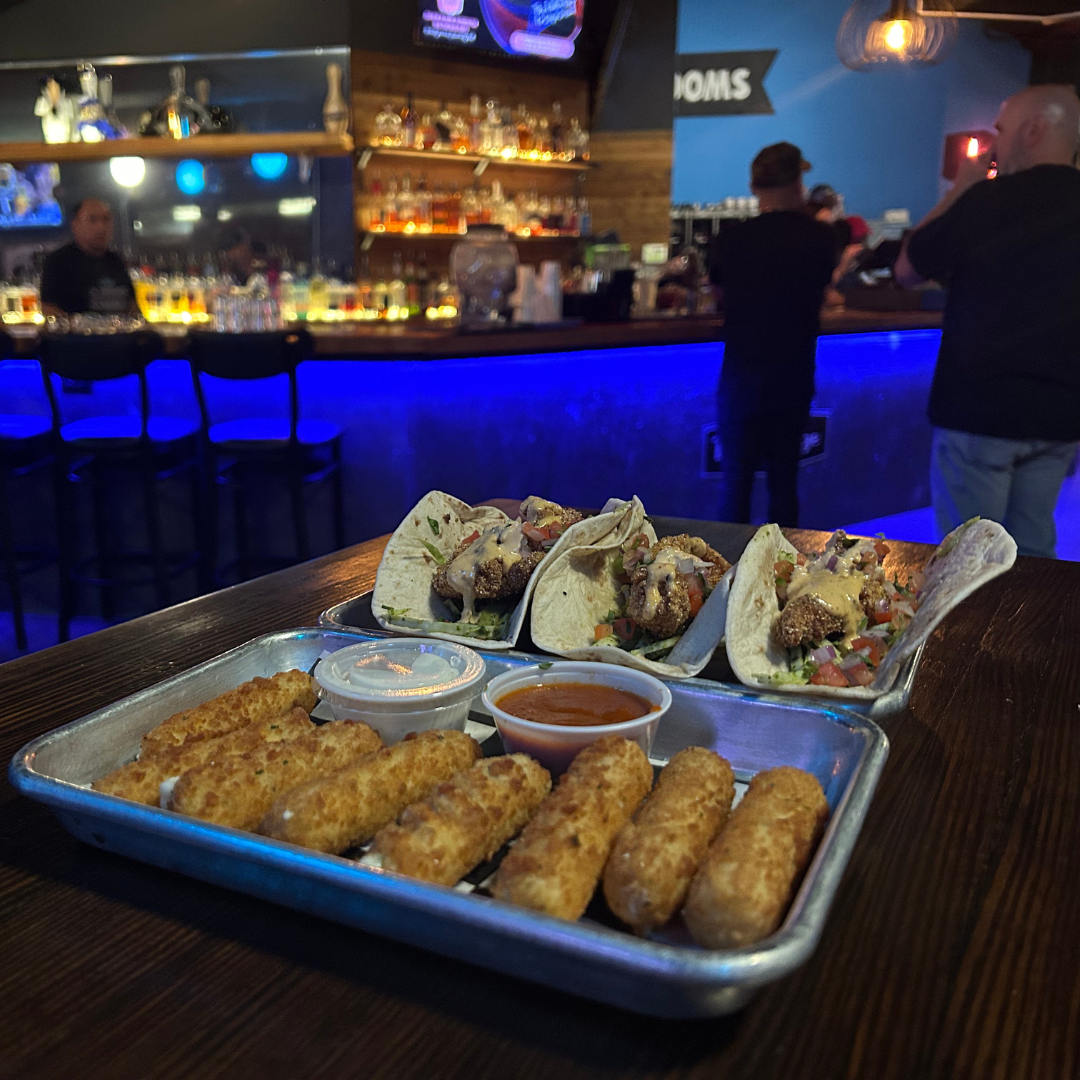 Mozzarella sticks and tacos, perfect for fueling bowling battles and laughter at Bowlounge.