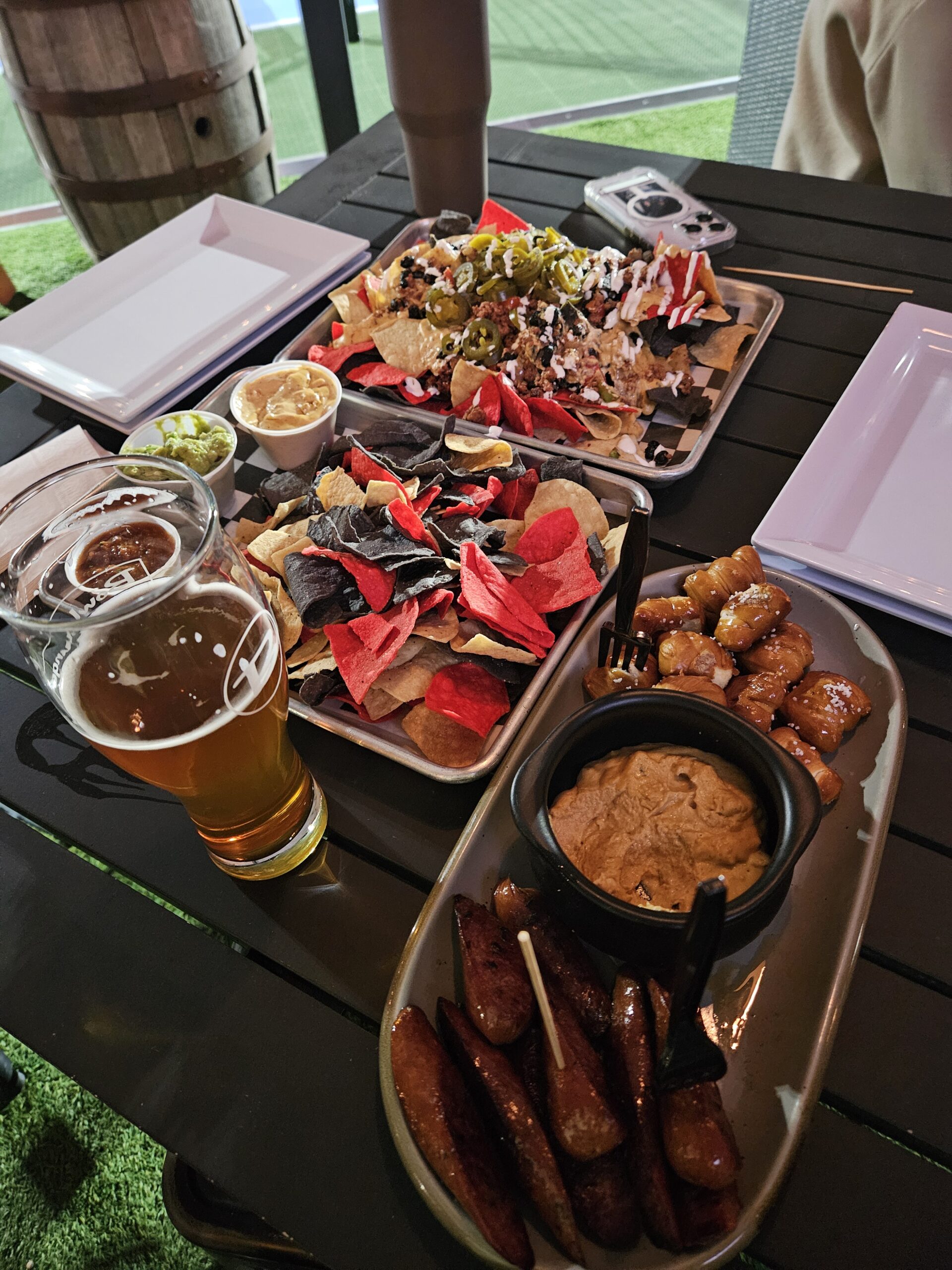 Catered food for a bowlounge private event, including chips and dip, nachos, and wings.