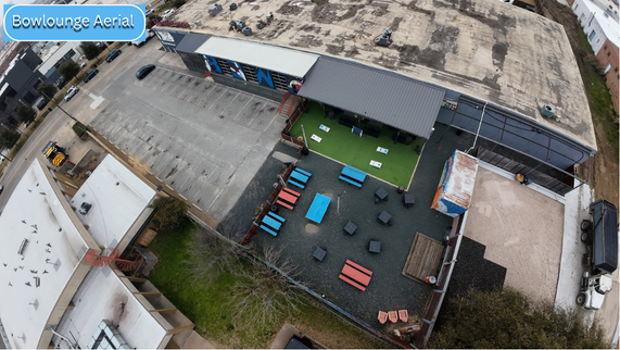 An aerial photo of the patio area and parking lot of Bowlounge